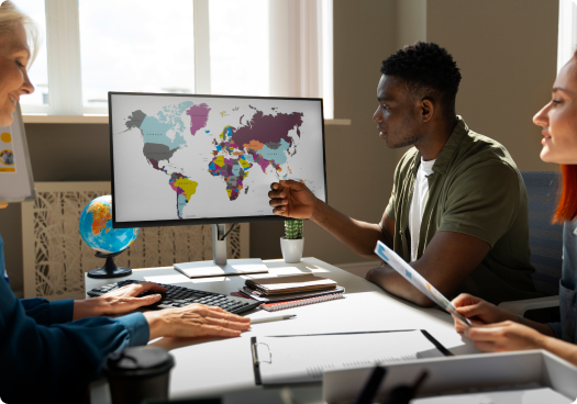 A group of people looking at a screen with a map.